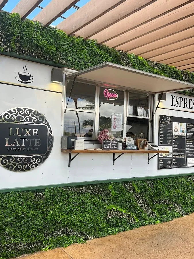 White Luxe Latte coffee kiosk under a pergola, with an open service window and menu boards.