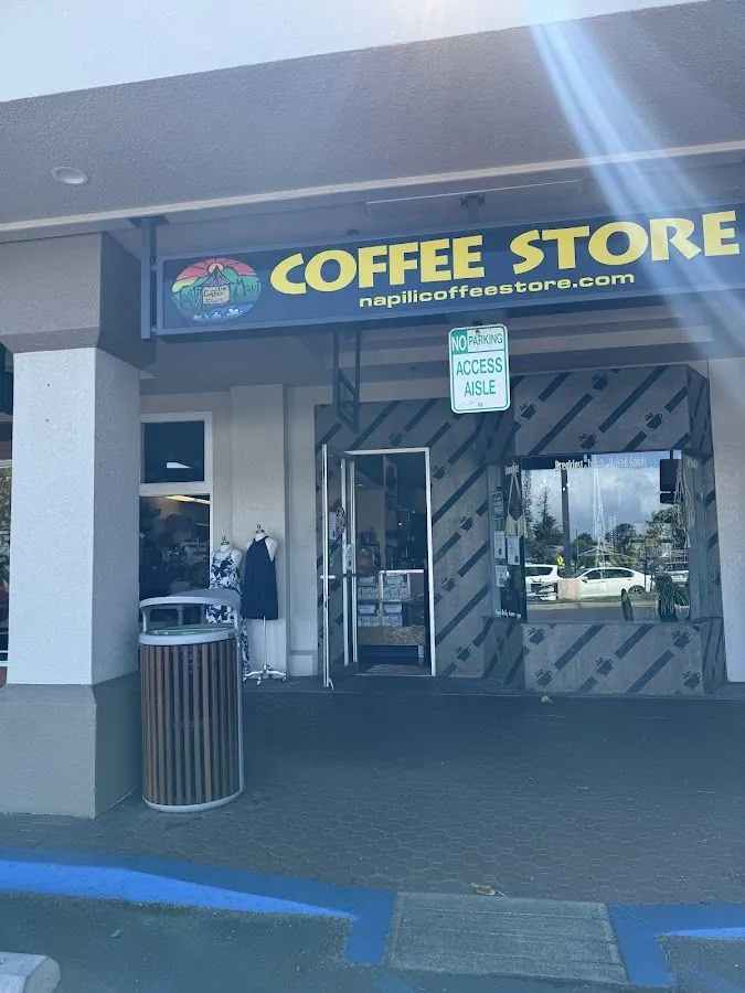Storefront with a yellow COFFEE STORE sign, an open door, and a green no-parking access aisle sign.
