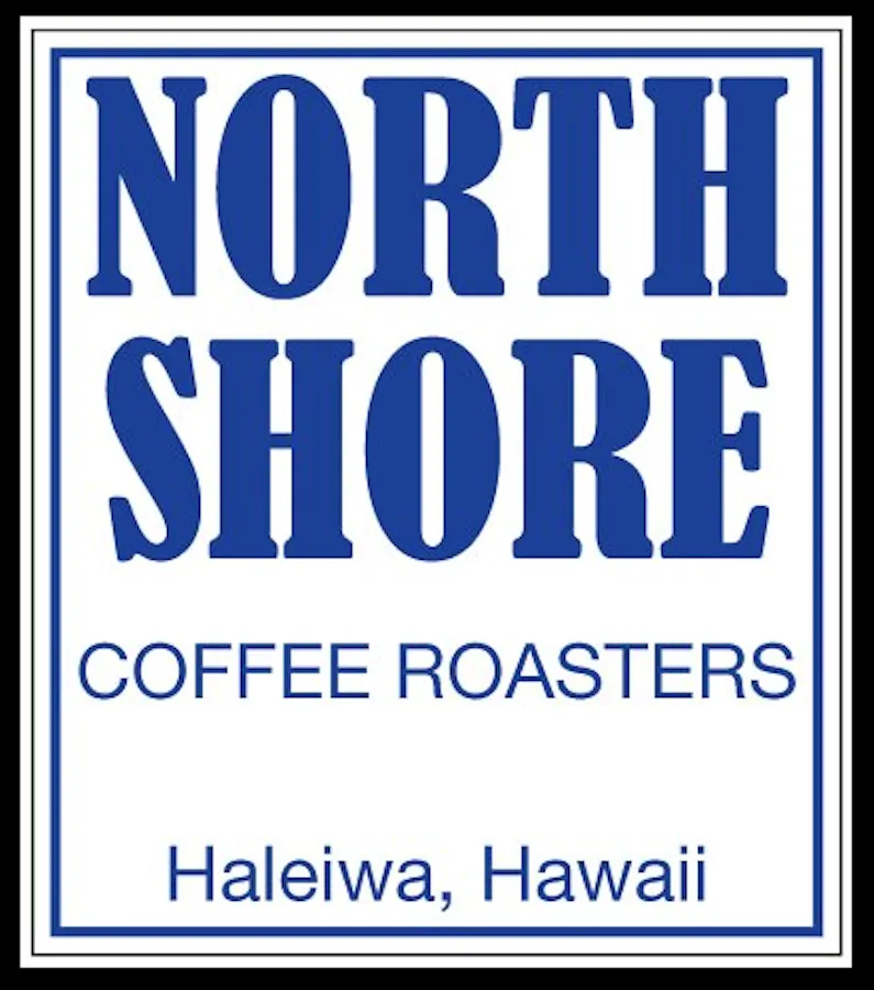 A blue-bordered white sign reads North Shore Coffee Roasters, Haleiwa, Hawaii.